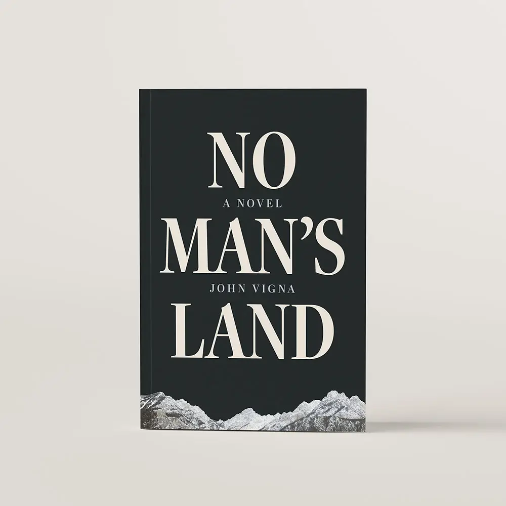Book Cover of novel, No Man's Land by John Vigna. The title is in a larger narrow vertical type, on a dark night sky background with a PNW mountain range at the very bottom of the cover. 