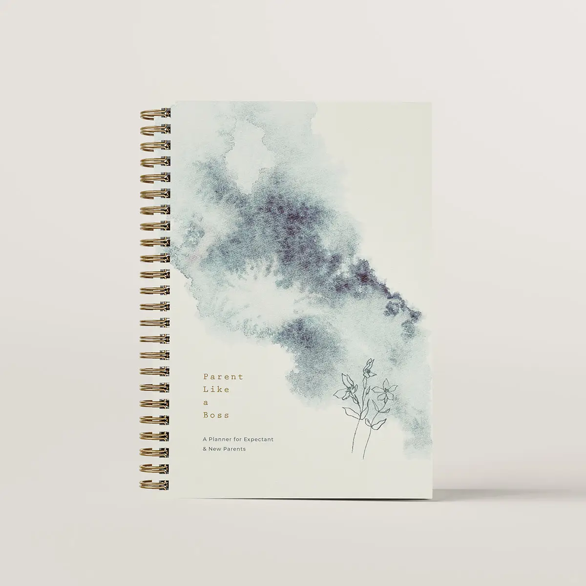 Journal cover for Parent Like a Boss. The journal is spiral bound and the cover features a watercolour swash with a small line drawing of a flower above the small title.