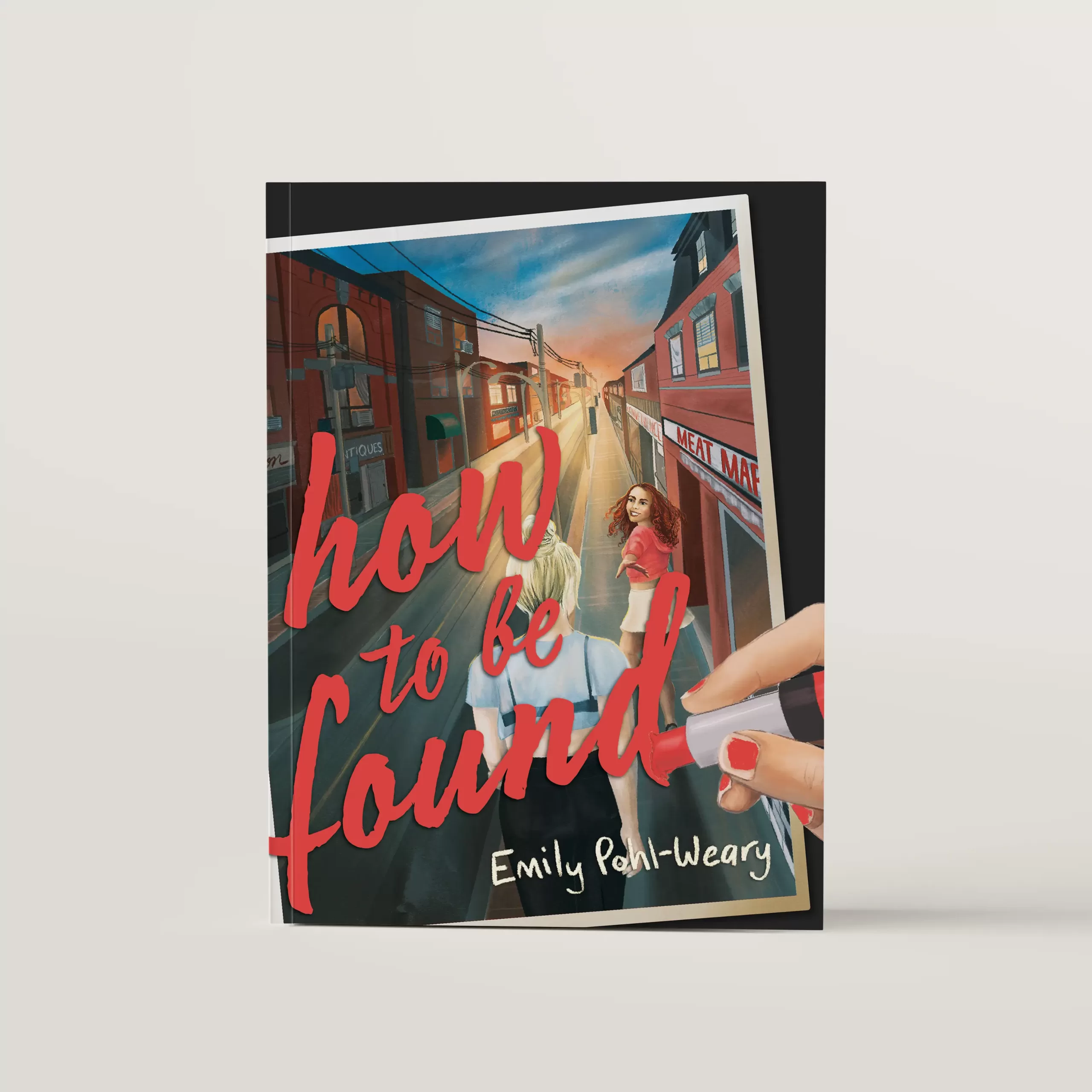 Cover design of How to Be Found featuring a drawing of two girls walking down a street in Parkdale, Toronto. A hand is drawing the letters of the title in lipstick on top of the image. Illustration by fleck creative studio.
