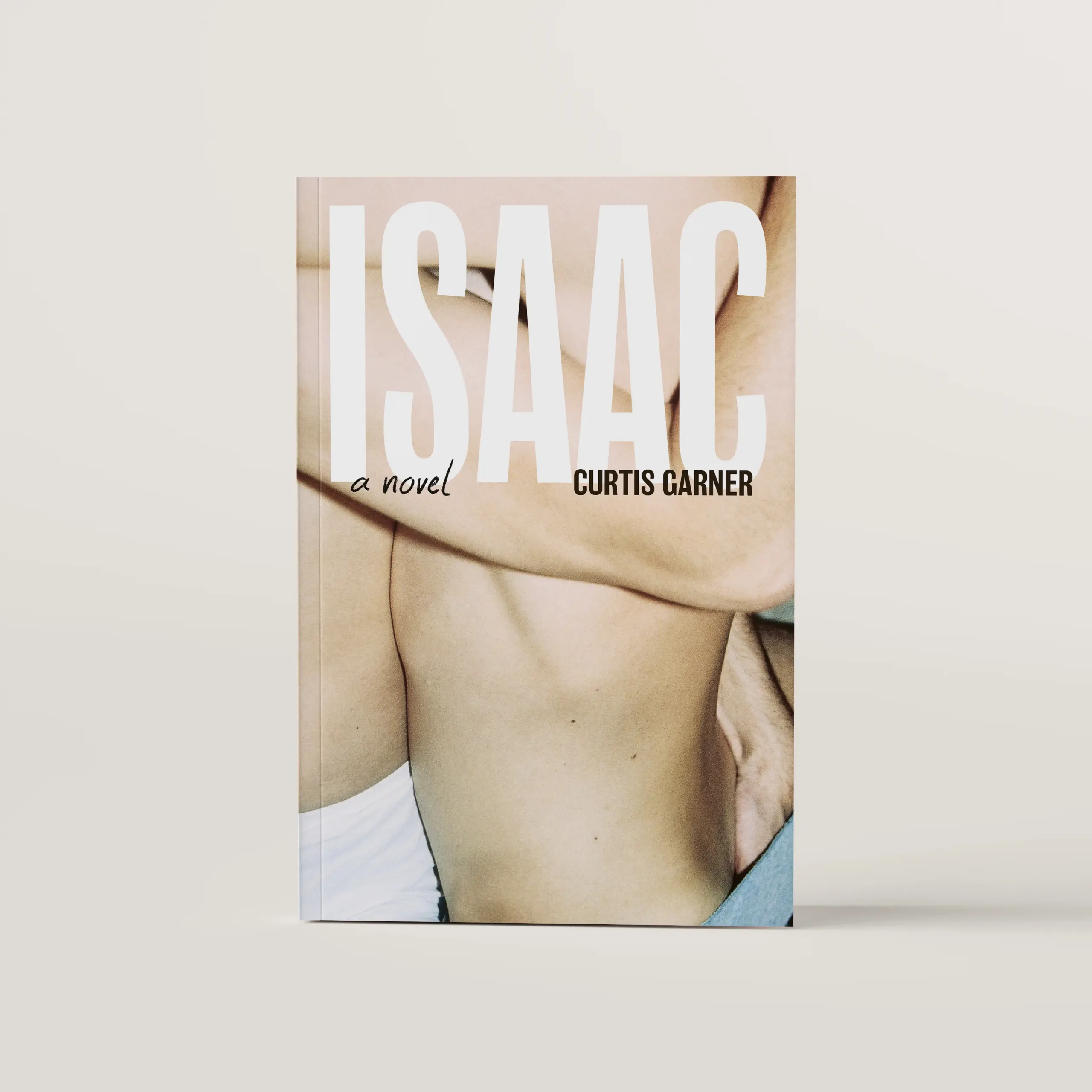 Isaac book cover, featuring close up photo of two men in just underwear in an erotic embrace.